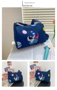 Close-up of a cylinder navy canvas bag with colorful space astronaut and rocket prints