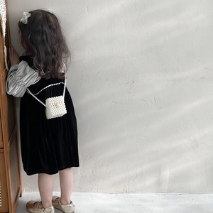 Girls fashion pearl crossbody mini bag with woven white beads on black velvet dress