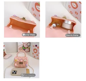 Detail of pink jelly handbag showing internal capacity and size compared to a smartphone