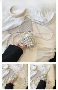 Detailed view of handmade white pearl bucket bag with beaded strap and satin lining
