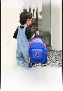 Detailed view of the blue canvas kids backpack with orange fashion letter printing