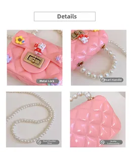 Detail of pink girls bunny bag with pearl handle, lattice pattern and gold metal lock