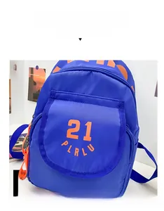Detailed view of royal blue nylon backpack featuring vibrant orange 21 PLRLU printed logo