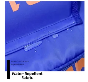 Macro shot of blue water-repellent fabric detail with orange letter print for school bag