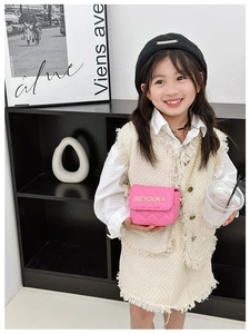 Pink quilted leather chain crossbody bag paired with cream tweed skirt suit for girls