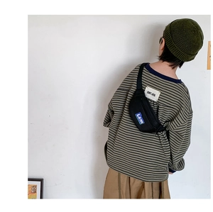Rear view of child wearing black nylon chest bag with LZM logo and adjustable strap
