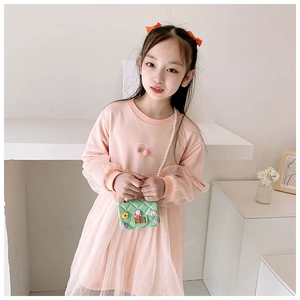 Detailed view of girls pink long sleeve dress with mesh sleeves and plush cherry charm