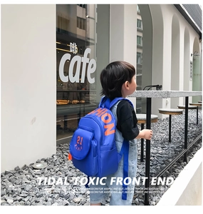 Detail showing royal blue canvas backpack with orange Fashion lettering and 21 print