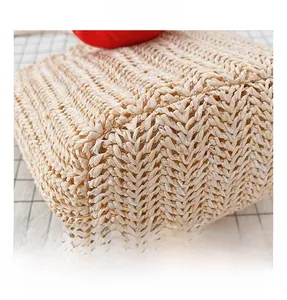 Close-up of beige straw woven bag featuring detailed V-shape cross patterns for kids