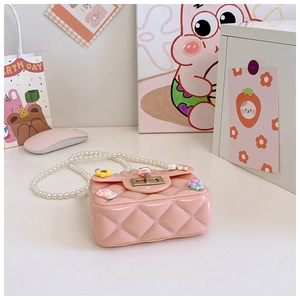 Pink jelly mini bag for girls with quilted texture, floral accents, and pearl strap