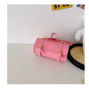 Sac à main cylindrique rose pour fille avec boucles dorées et poignée en lumière douce