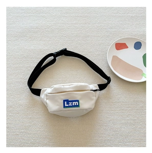 Detail of white mini belt bag for kids with adjustable strap and rubberized logo label
