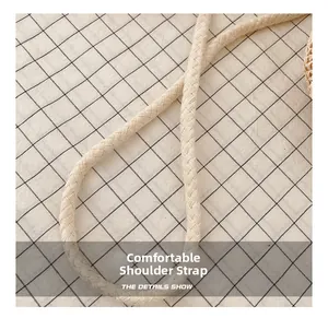 Detail of hand-woven beige shoulder strap with braided rope texture and soft padding