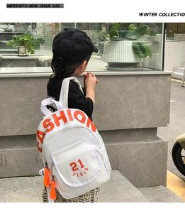 Detail of kindergarten canvas backpack showing side view and white waterproof fabric texture
