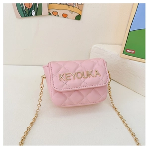 Detailed view of pink quilted mini chain bag with gold metal lettering for girls