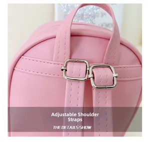 Close-up of adjustable pink PU leather shoulder straps with silver metal buckles