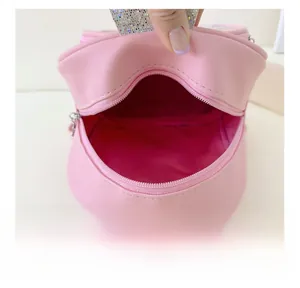 Detail view of pink PU leather toddler backpack interior with sequin trim and zipper