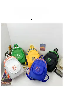 Five assorted colors of mini canvas backpacks with number 21 and letter prints for kids