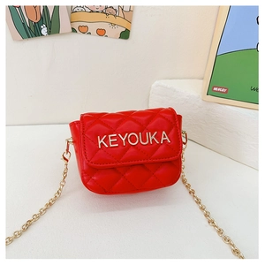 Detail of red quilted mini chain bag for girls with gold brand logo and metal strap