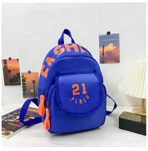 Close-up of blue canvas school bag with orange 'FASHION' text and zippers