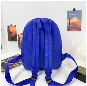 Detail view of the royal blue canvas backpack back with padded straps and top handle