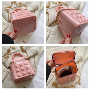 Pink jelly mini bag with 3D pyramid studs and golden chain strap for girls