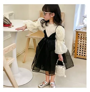 Detail of elegant two-tone princess tutu dress with puff sleeves and large bow decoration