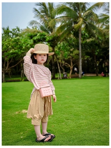 Pink studded jelly shoulder bag with girls striped top and casual cotton lantern pants