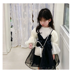 Detail of girls princess puff sleeve top and mesh dress with pearl beaded handbag