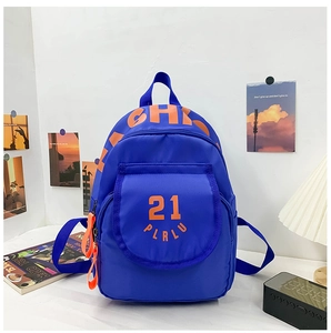 Close-up of blue canvas backpack with orange 21 PLRLU text and decorative side zipper tag