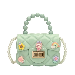 Mint green kids jelly handbag with cartoon flower charms and pearl handle strap