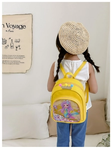 Detail of toddler girl yellow backpack with mermaid print and glitter shake pocket