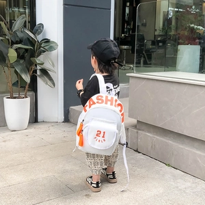 Kids white canvas backpack with orange fashion letter print for preschool school use