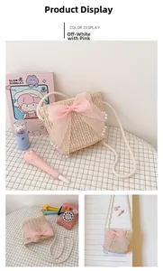 Detail of girls straw crossbody bag with pink sheer bow and delicate pearl accents