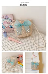 Detail of kids straw bag with a large blue mesh bow and decorative white pearls