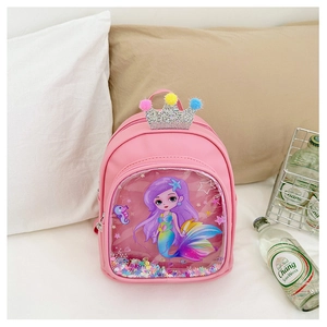 Detailed view of pink mermaid toddler backpack featuring a sequin crown and pom-poms