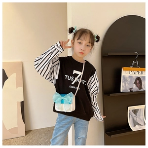 Detail of trendy girl's black sweatshirt with striped sleeves and letter print