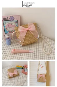 Detail of khaki straw bag with large pink tulle bow and white pearl accents for girls