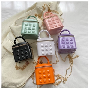 Detailed set of mini crossbody bags with pyramid studs in six vibrant pastel colors