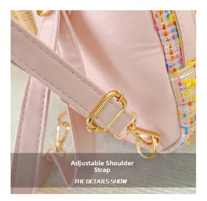 Detail of adjustable shoulder strap with gold metal buckle on pink girl's backpack