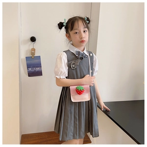 Close-up of pink leather strawberry crossbody bag for girls with high-quality 3D fruit detail