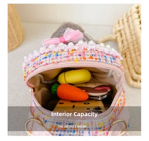 Internal view of tweed children's bag with pearl and bow detail showing inner capacity