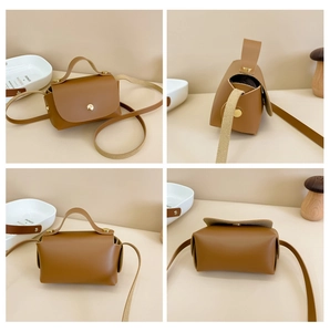 Detailed views of caramel brown mini crossbody bag with gold snap and top handle