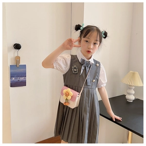 Close-up of a girl's stylish PU leather crossbody bag with cute flower decoration
