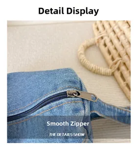 Detailed macro view of high-quality blue denim fabric texture and smooth metal zipper