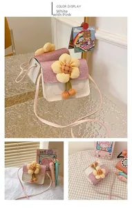 Detail of pink glitter flap and white PU leather on mini crossbody bag with yellow flower
