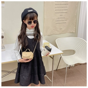 Chic beige mini crossbody bag for girls styled with classic beret and black sunglasses