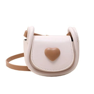 Mini saddle crossbody bag in cream leather with brown heart decoration for women