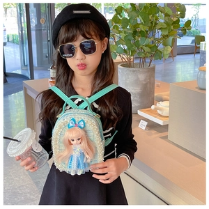 Detail of girls tweed backpack in mint green with 3D doll and pearl embellishments