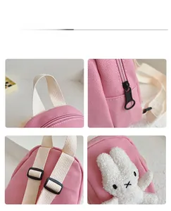 Detail shots of pink canvas backpack featuring rabbit plush decor and adjustable straps